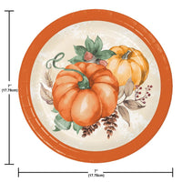 Round plate with pumpkins and leaves design, size indicated as 7 inches.